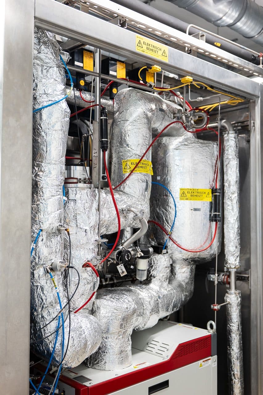 Heated and insulated process lines inside the atomic layer deposition coating plant.